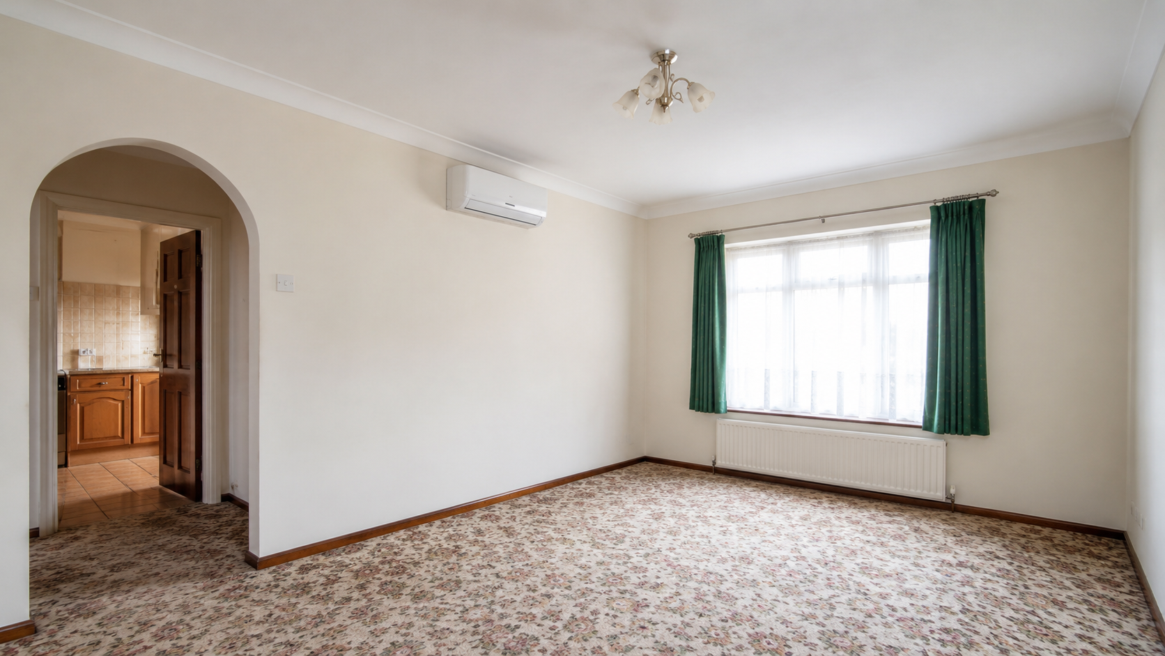 Wall-mounted air conditioning unit in a UK property